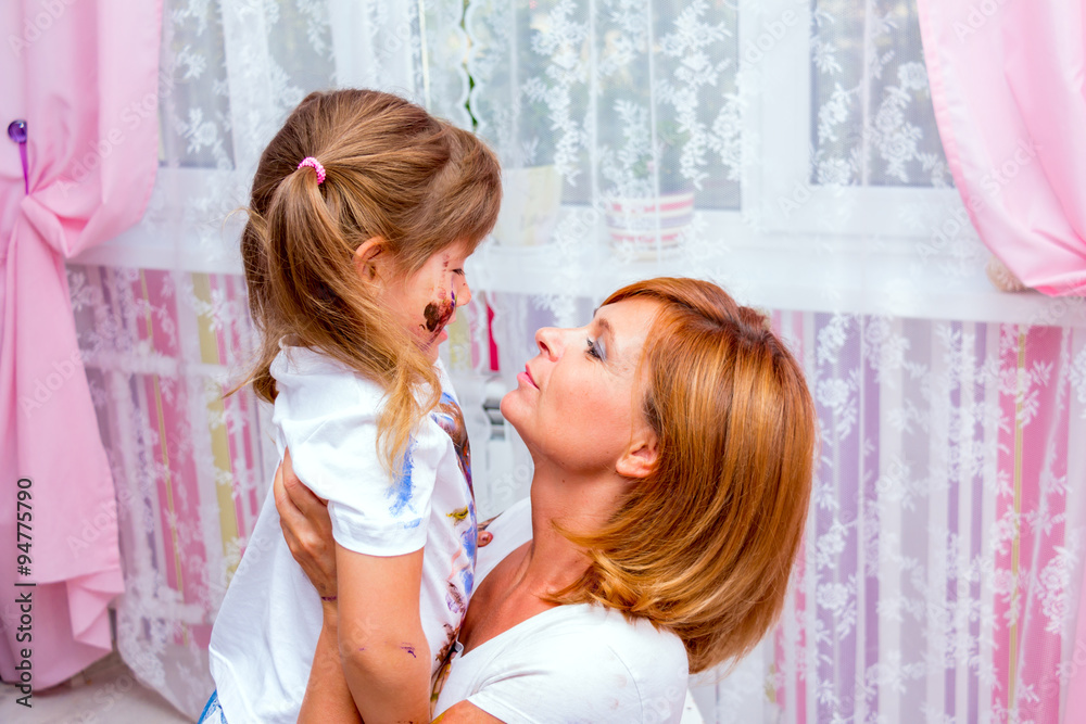 Woman playing with her daughter. Woman playing with her daughter.