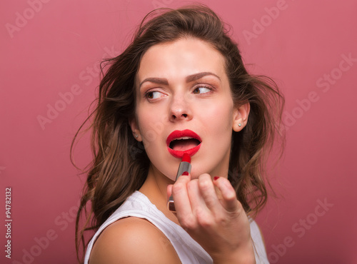 Beautiful woman with a lipstick