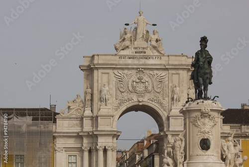 Architectural close up of the equestrian Statue of King Joseph and Rua Augusta Arch in Commerce square in Lisbon