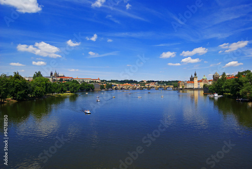 View of the Charles Bridge and Prague Castle from the river Vltava in Prague Czech Republic