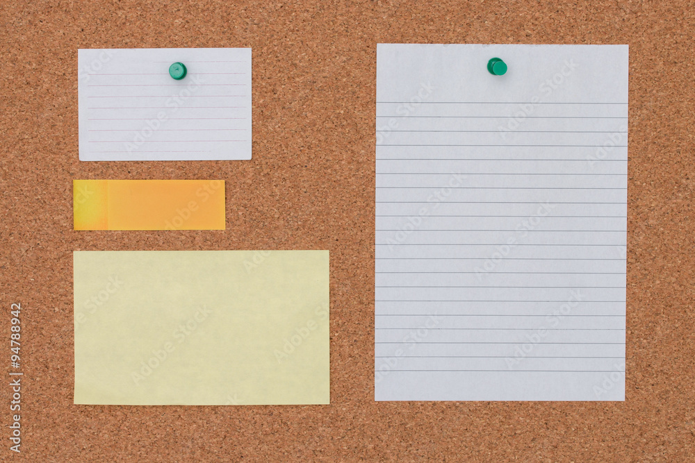 Paper note with pushpin on cork board background. Paper note with pushpin on cork board background.