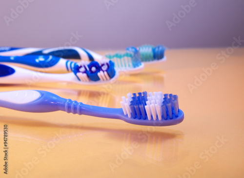 toothbrush on the background of other toothbrushes  shallow depth of field  closeup