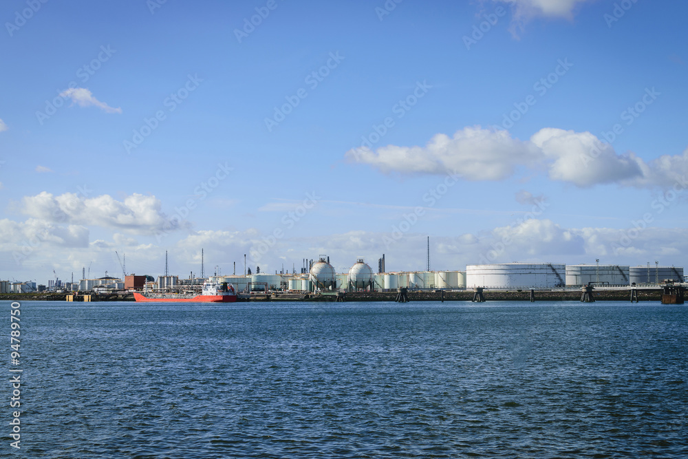 Oil refinery industry with oil storage tanks in the port of Nort