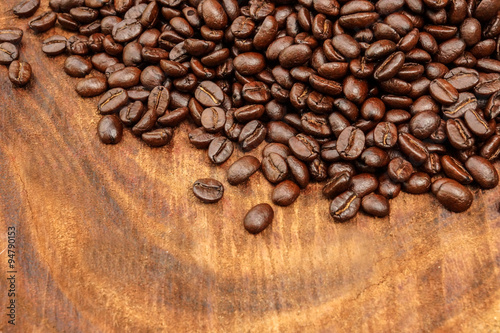 Roasted coffee beans on wood.  Arabica coffee 