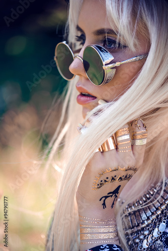 Girl in sunglassses outdoors photo