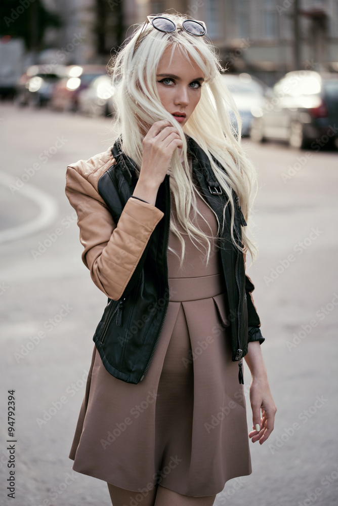 Fototapeta premium Blonde young girl in posing outside