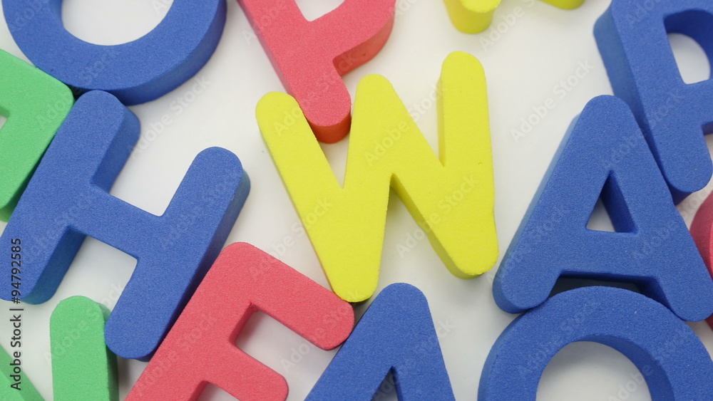 Alphabet background with mixed colorful letters. Slowly turn. 4K UHD 2160p.