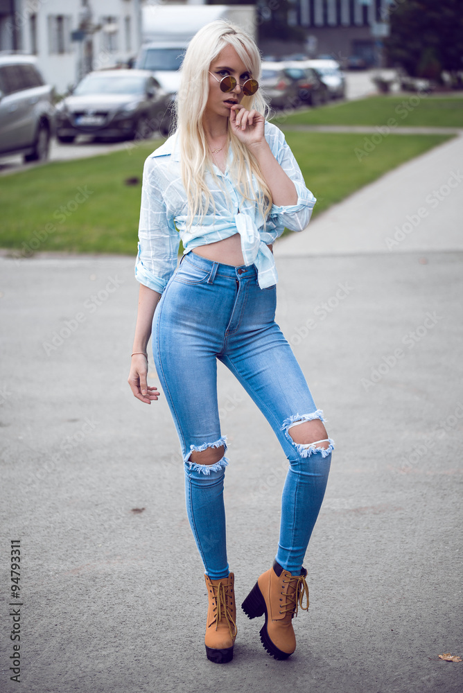 Stylish blonde girl in posing