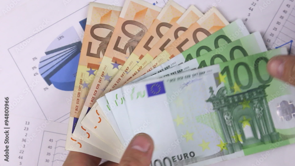 Man's hand believes euro Man's hand believes euro