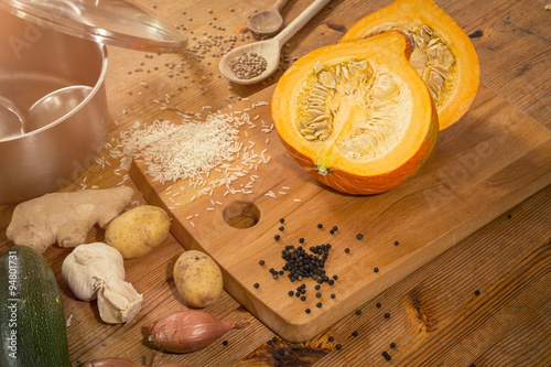 cooking scene - preparing a pumpkin soup on a countertop