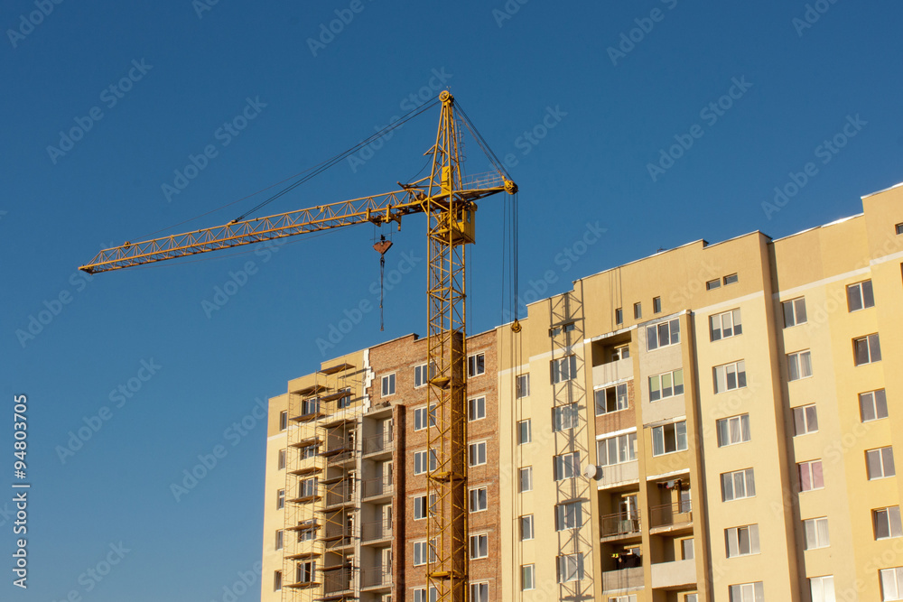 Crane and construction site Crane and construction site