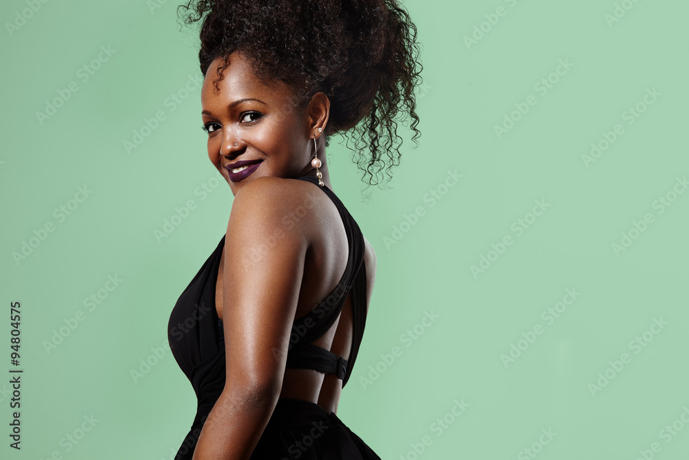 black woman turning back and watching in camera black woman turning back and watching in camera
