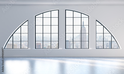 An empty modern bright and clean loft interior. New York city view. A concept of luxury open space for commercial or residential purposes. 3D rendering.