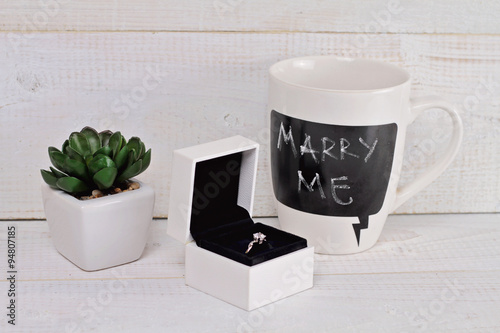 Engagement ring box and words Marry me written on Mug. Love  Wedding  Proposing  Marriage concept. Rustic chic style