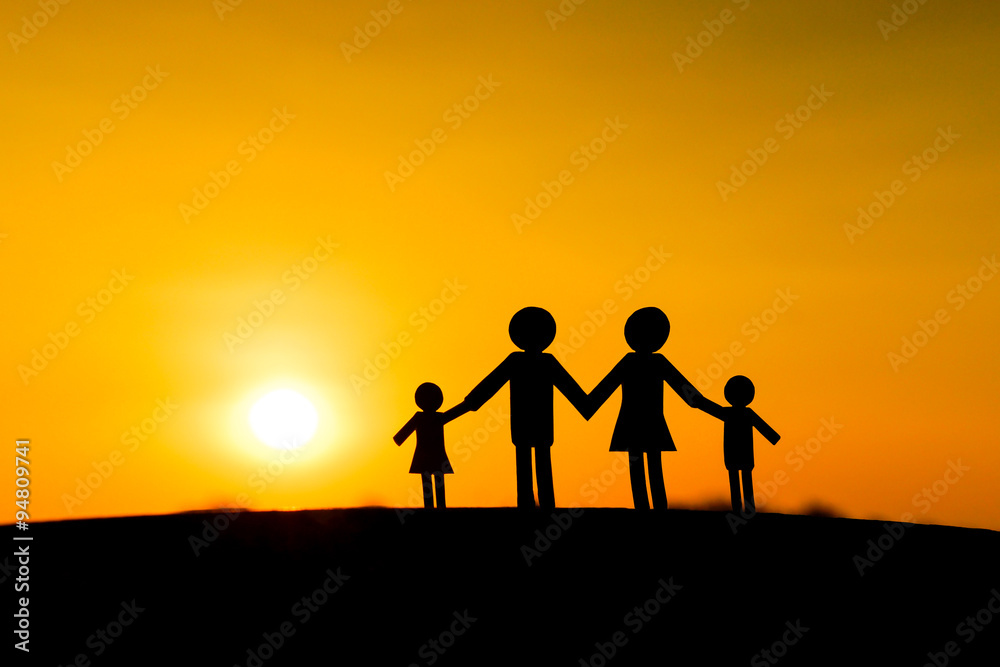 Paper cut of family with sunset background / Family Life Insurance / Protecting family / Family concepts