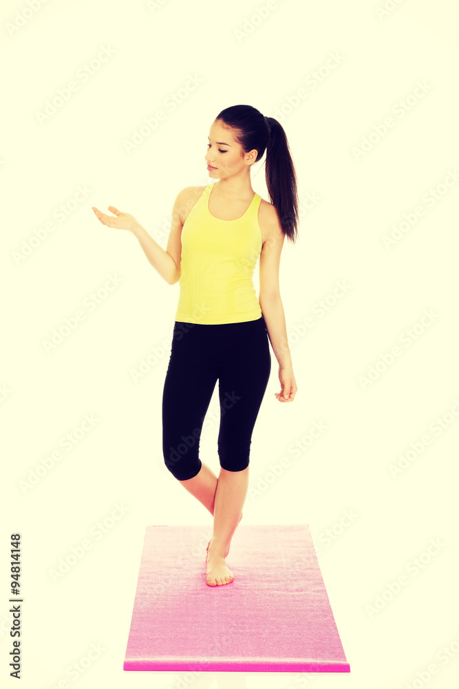 Beautiful woman in sportswear with empty hand. Beautiful woman in sportswear with empty hand.