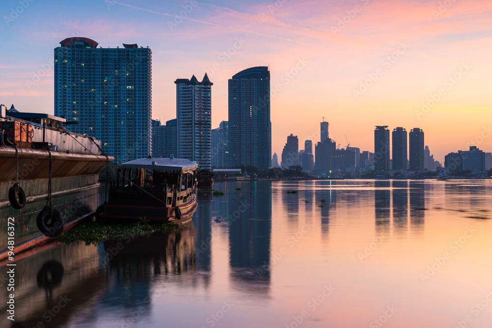 Bangkok city sunrise view with reflection in river (Chao Phraya river), Bangkok cityscape , long exposure photograph. Bangkok city sunrise view with reflection in river (Chao Phraya river), Bangkok cityscape , long exposure photograph.