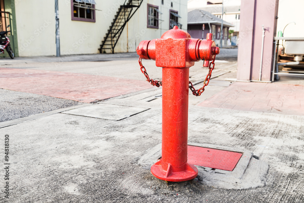 Red fire hydrant at strategic residential ready for emergency Red fire hydrant at strategic residential ready for emergency