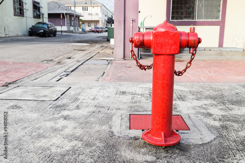 Red fire hydrant at strategic commercial area ready for emergenc