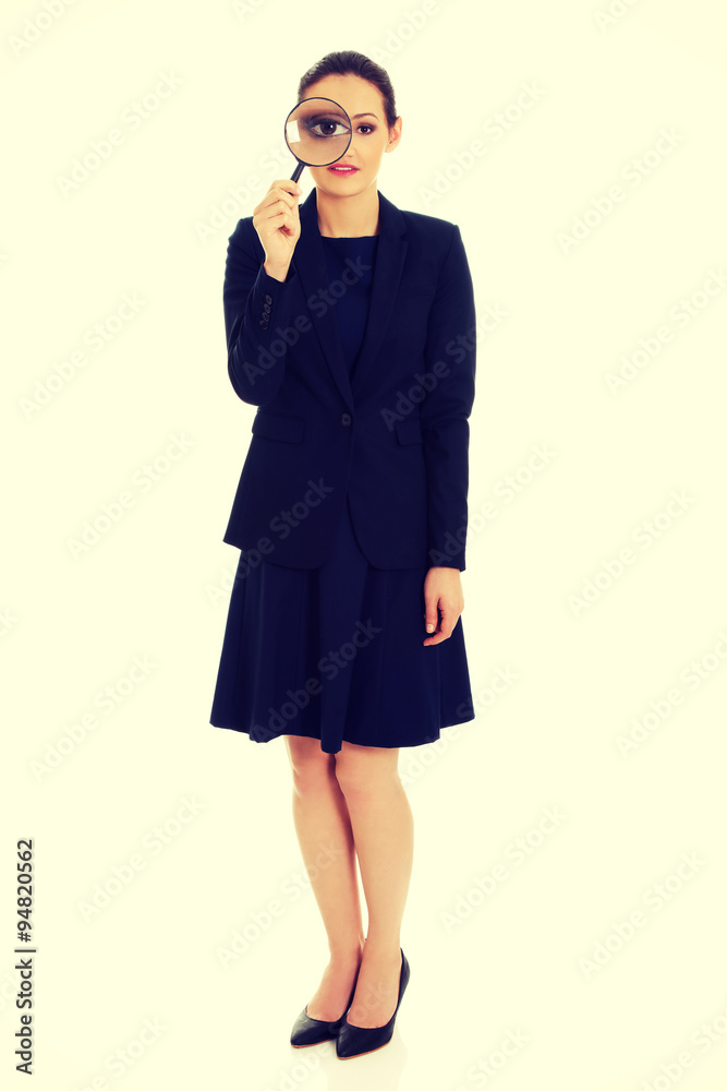 Businesswoman with magnifier glass. Businesswoman with magnifier glass.