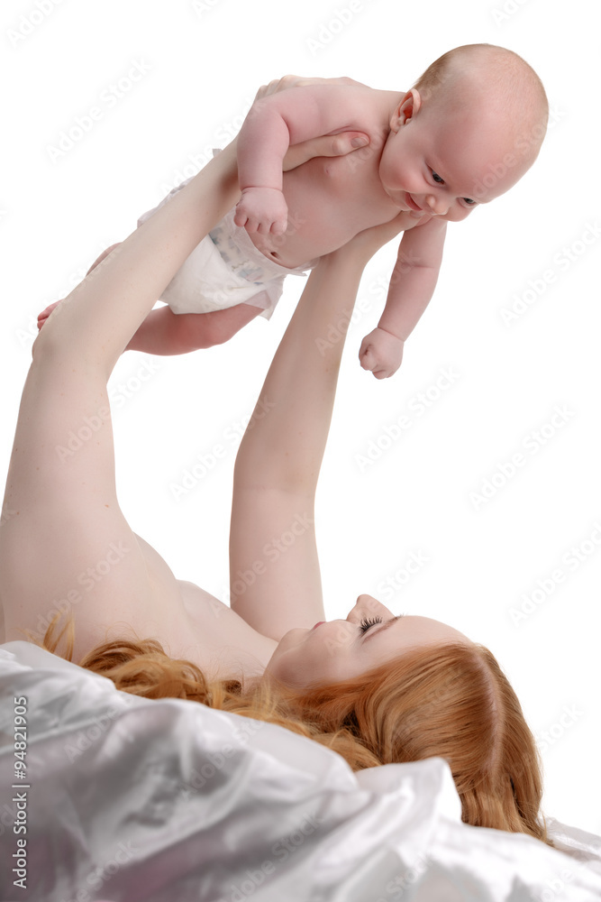 Mother playing with her little son and he smiling Mother playing with her little son and he smiling