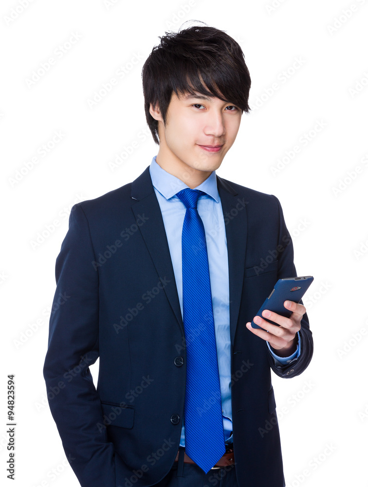 Asian Young Businessman use of the mobile phone Asian Young Businessman use of the mobile phone