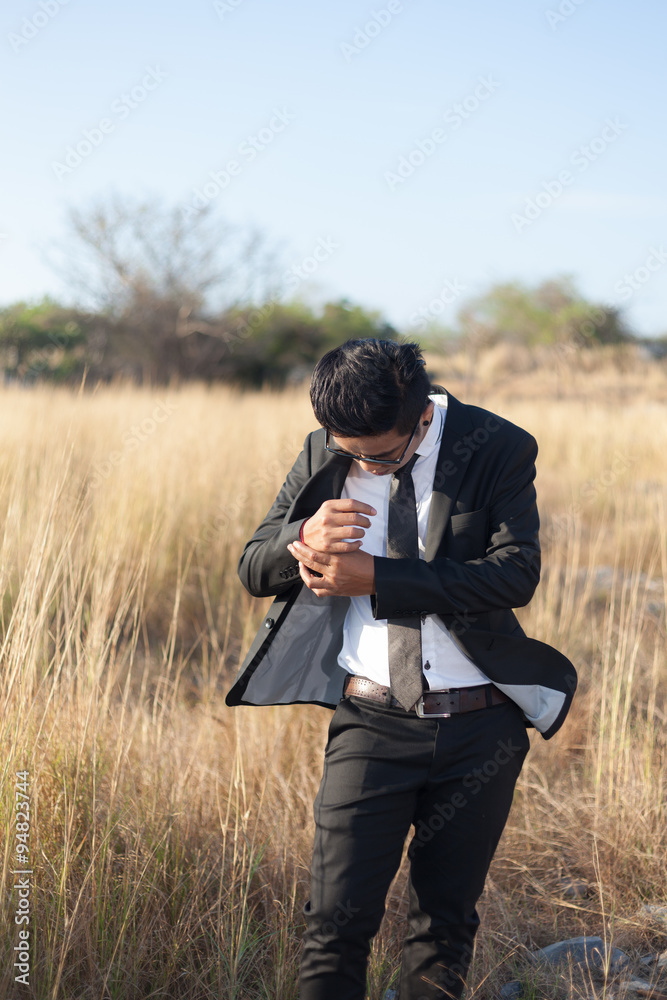 Asian male wearing a black suit Asian male wearing a black suit