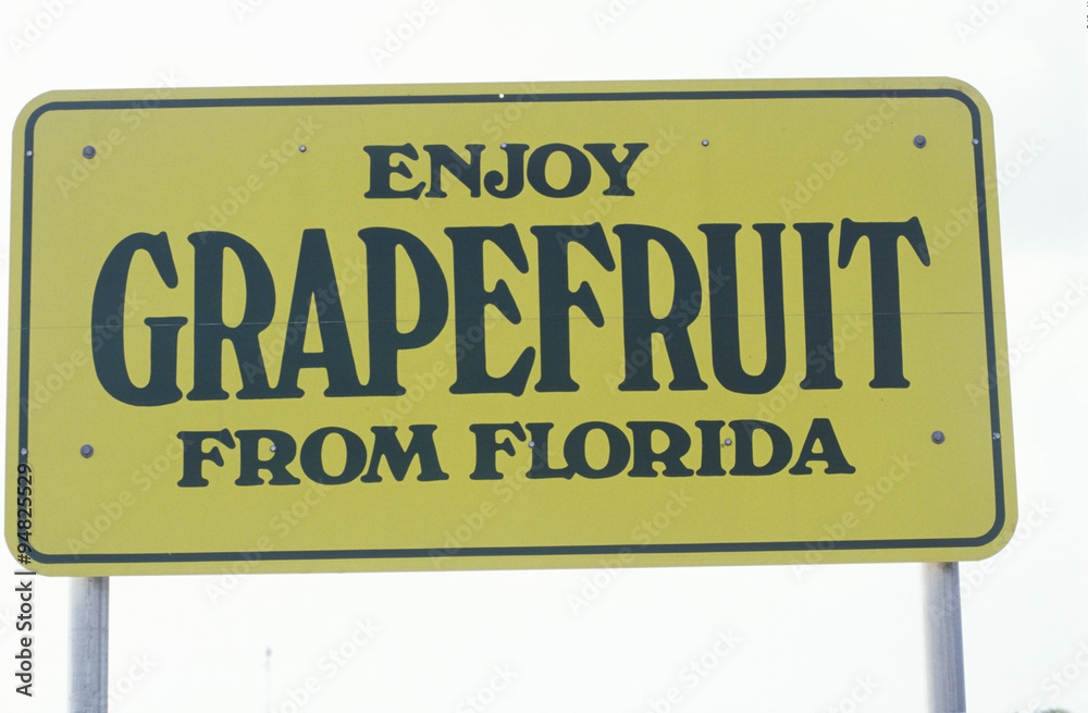 Fototapeta premium A sign that reads ÒEnjoy grapefruit from FloridaÓ