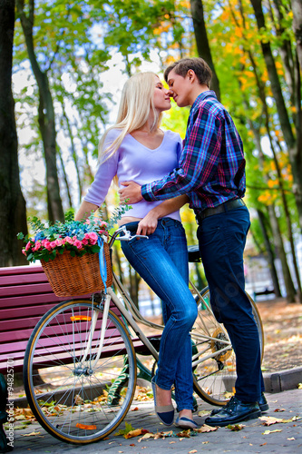 Couple with retro bike in the park
