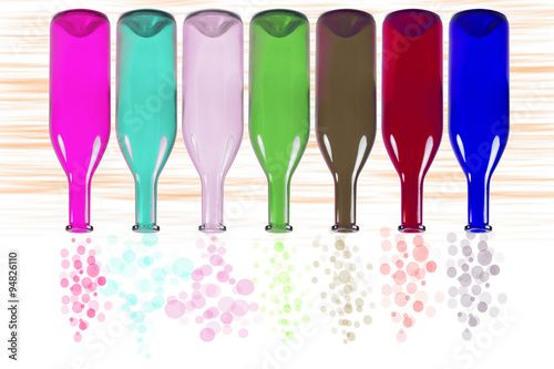 Bottles with bubbles isolated on blurred background