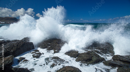 flying foam by the shore photo