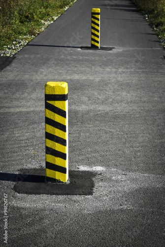 Warning concrete pillars on the road