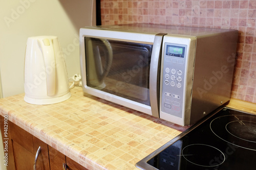 Electric kettle and microwave oven in the kitchen environment