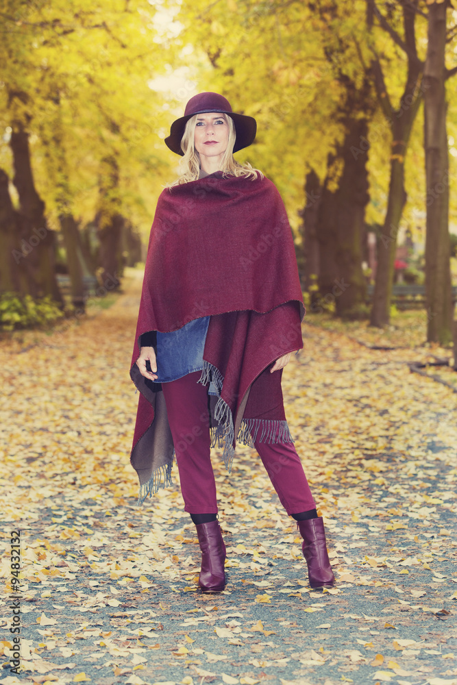 blond woman in a park in autumn