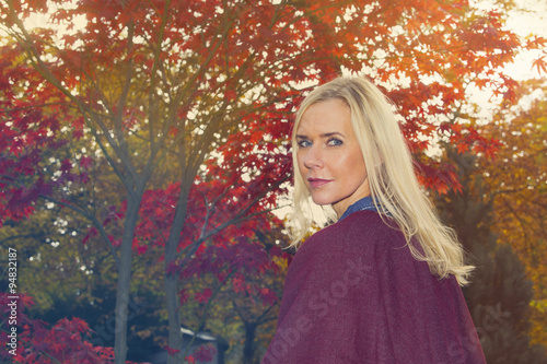 blond woman in a park in autumn