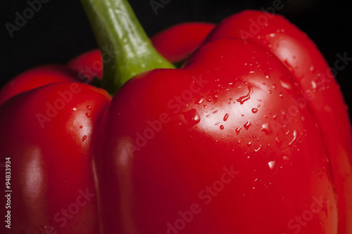 Tableau sur toile Close-up of fresh red pepper with droplets