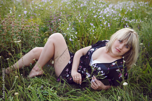 girl in lingerie lying on the background of beautiful nature