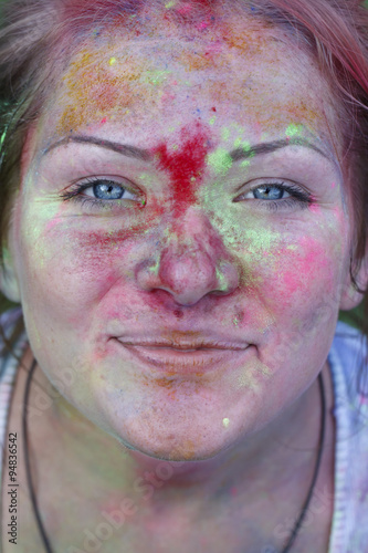 happy young girl on the Holi festival