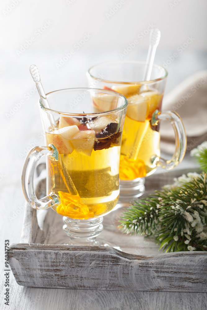glass of mulled apple cider with orange and spices, winter drink glass of mulled apple cider with orange and spices, winter drink