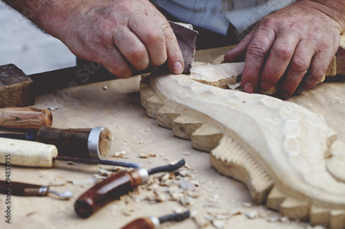 wood carvings, tools and processes work closeup photo