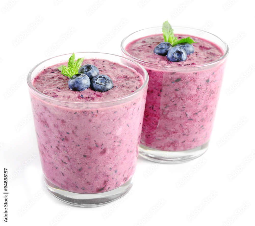 Glass of blueberry smoothie isolated on white Glass of blueberry smoothie isolated on white