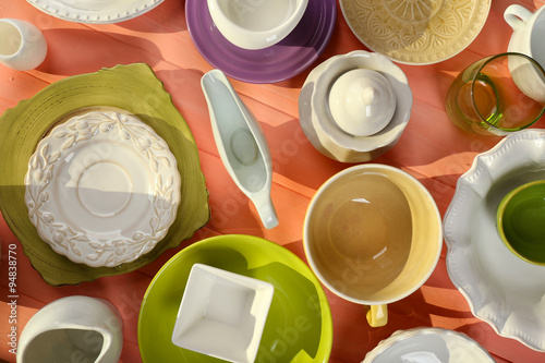 Different tableware on wooden table close up