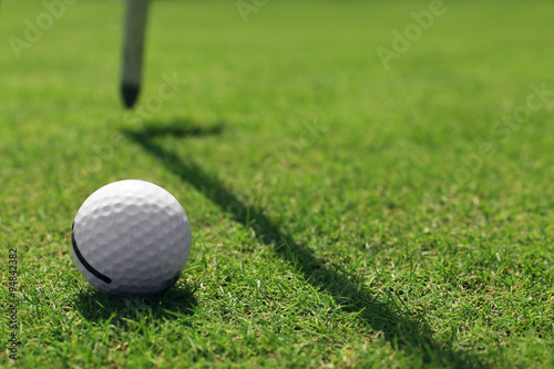 Golf ball on green golf course