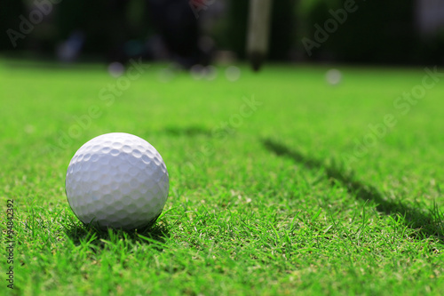Golf ball on green golf course