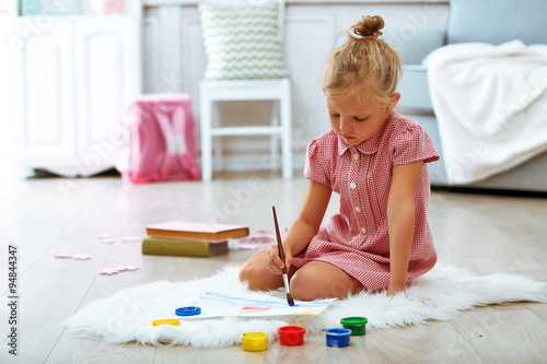 Little girl drawing in the ...