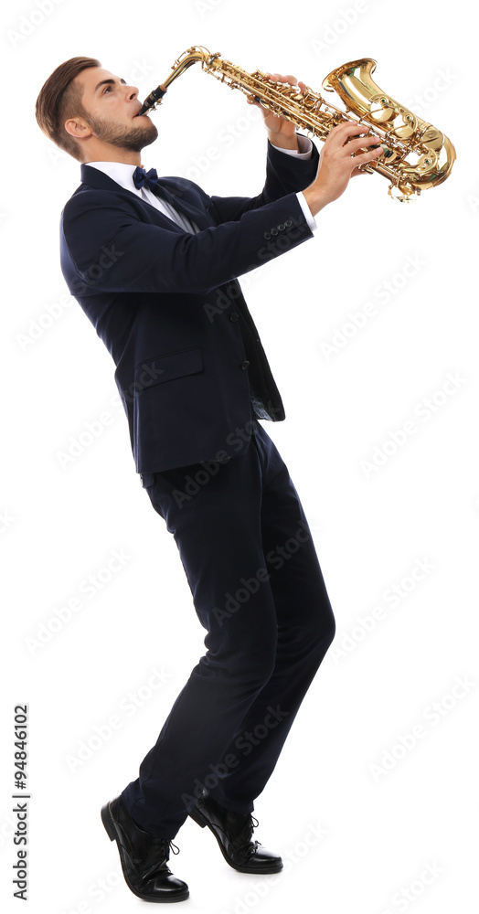 Fototapeta premium Elegant happy saxophonist plays music on sax on white background