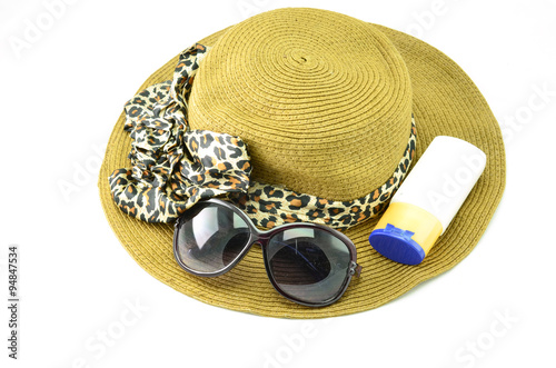 Sunscreen  sunglasses and hat. Three essential items of sun protection on a white background