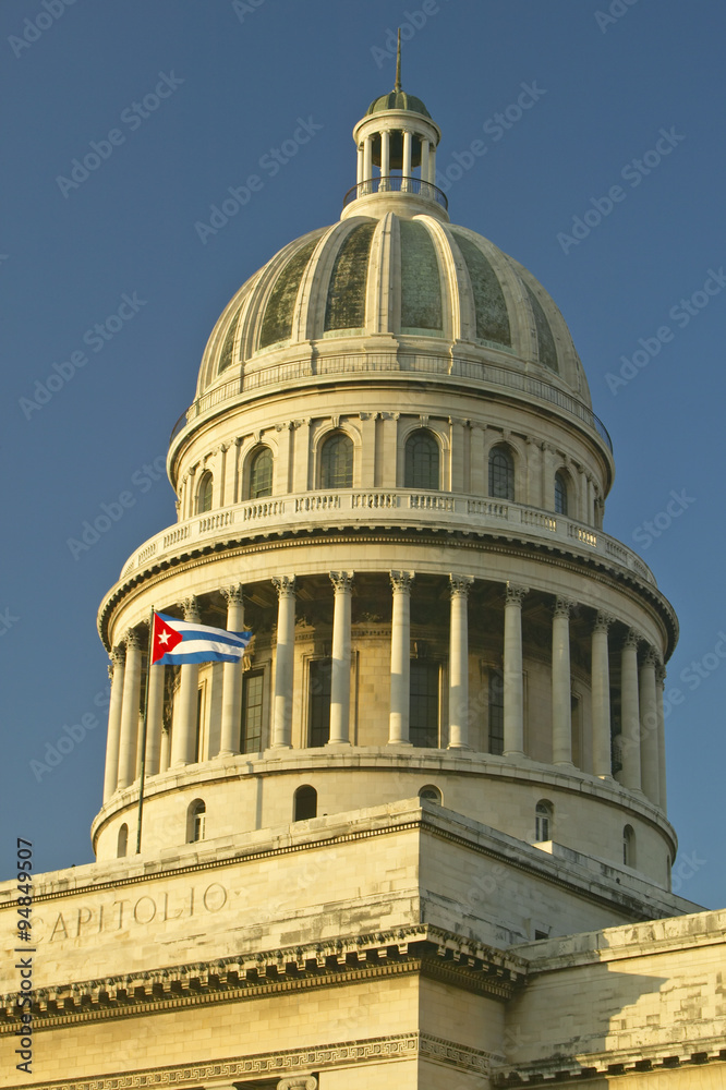Morning light on the Capitolio and Cuban Flag, the Cuban capitol building and dome in Havana, Cuba