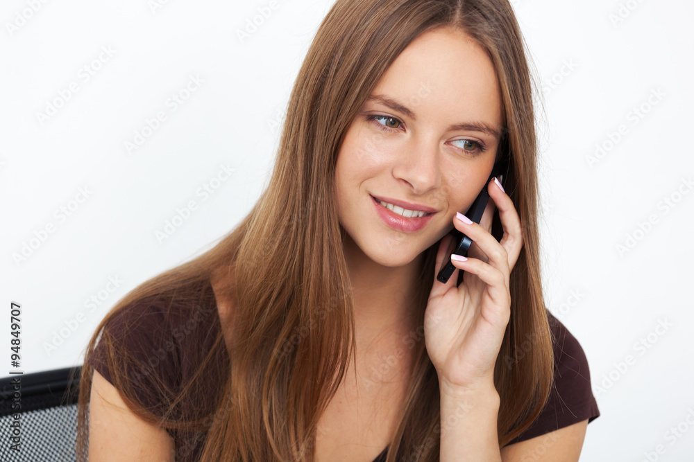 Portrait of young business woman working at her office. Portrait of young business woman working at her office.