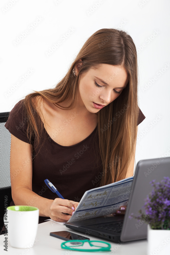 Portrait of young business woman working at her office. Portrait of young business woman working at her office.